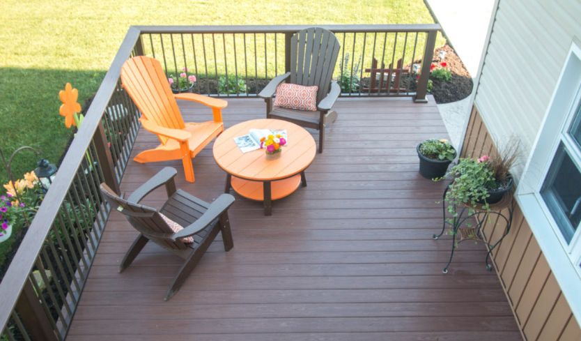 Outdoor sitting area with railing on deck
