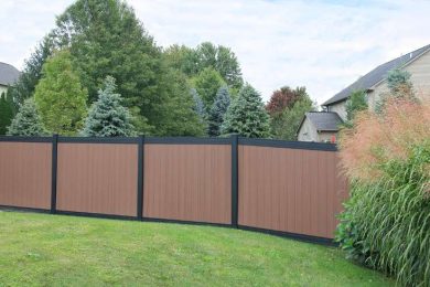 Brown vinyl fence panel with black trim around border