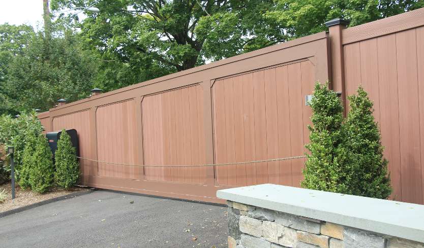 Brown fence panels with aluminum accent