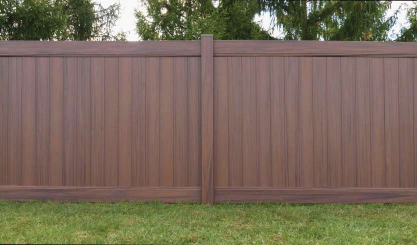 Light brown vinyl fence panels for privacy in the backyard